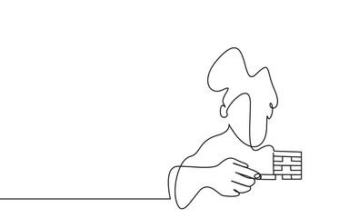 one person is playing the block tower game and taking a bit of risk