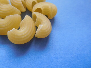 close up of pasta on blue background