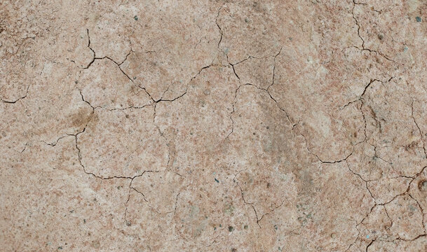 Cracked ground background in the top view for graphic design or wallpaper