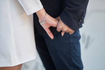 the groom holds the bride's hand. close-up of the hands of the newlyweds.wedding day