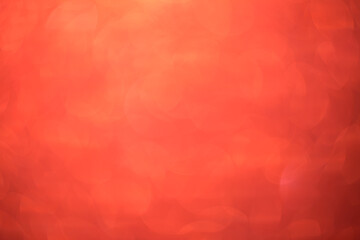 Red bokeh background. Festive Christmas shiny background. Glittering red light.
