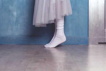 Woman dancer in white socks on floor. © Antibydni