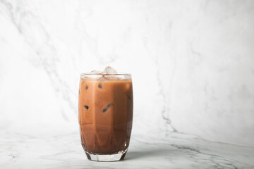 Iced cocoa in clear glass on marble,copy space for your text