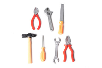 Plastic toy tools isolated on a white background.