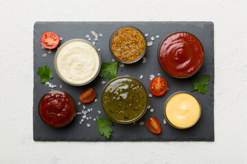 Fototapeta na wymiar Many different sauces and herbs on table, flat lay top view. sauces on plate, healthy concept