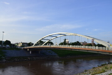 Naklejka premium The bridge over the river is a steel frame.