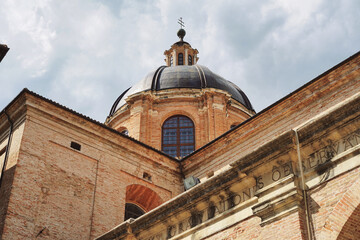 Urbino, Italy - 05 05 2020: Famous cathedral in the historic center of Urbino. Bottom view of the...