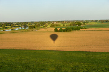 Hot air balloon shadow on the field