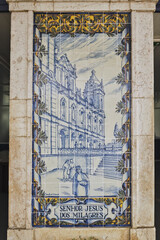 azulejos panel representing monuments and country scenes on the walls of Leiria station, Portugal
