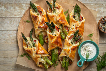 asparagus and bacon puff pastry bundles - obrazy, fototapety, plakaty