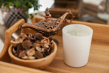 Aroma Potpourri and candle on wooden table, eco aromatic home decor and apartment living decorative bowl. yoga, scent, smelling good, candles
