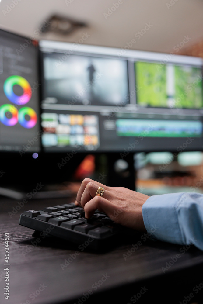 Poster close up shot of video graphic editor using specialized software to edit movie footage and improve v