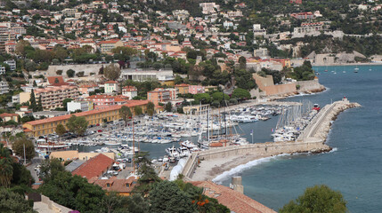 Fototapeta premium Picturesque beautiful small town on the mediterranean sea. French riviera coast near Monaco. Old port from aerial view