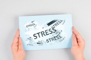 The word stress is standing on a paper, pen with eraser, burnout concept, work life balance, breakdown by exhaustion
