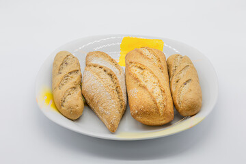 delicious wholegrain muffins and cereals in a porcelain plate isolated on a white background
