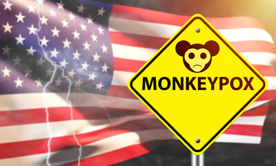 Monkeypox in USA. Inscription monkeypox in front of flag of America. Smallpox cases in USA. Outbreak of monkeypox in United States of America. Monkey fever epidemic in US. 3d rendering.