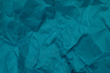 Crumpled blue paper craft textured background