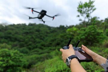 Flying drone in spring forest