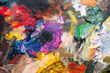 Colorful abstract background. Colorful background from smeared paints on canvas.