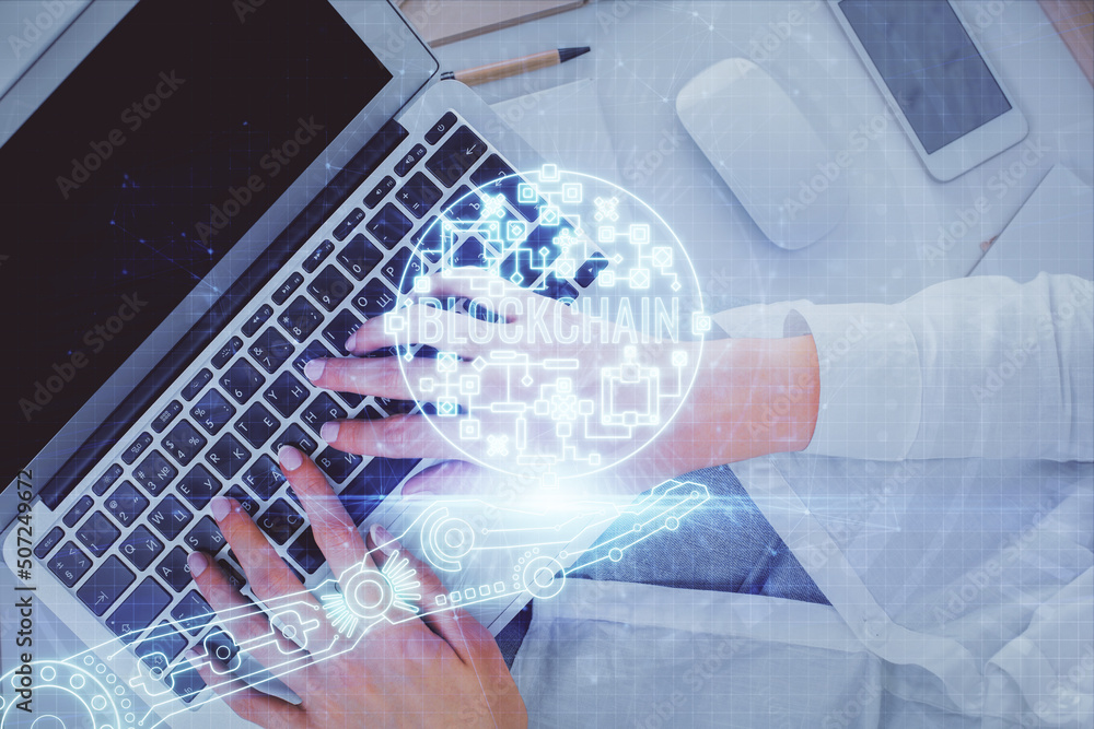Poster double exposure of woman hands working on computer and blockchain theme hologram drawing. top view. 