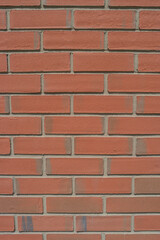 Pattern of modern bricks of a building wall, as a background, closeup, details.