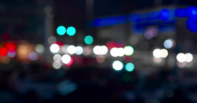 Night traffic in the city in defocus. Bokeh of cars and traffic lights night.