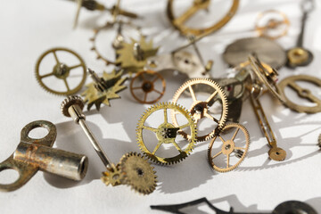 Clock mechanism, gears, wheels, wristwatch parts. Turning cogwheels close-up.