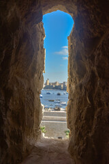Looking from one of the fortifications of Qaitbay Citadel in Alexandria, where the soldier stands holding his bow and arrows and defending the fortress against the enemy coming from the sea