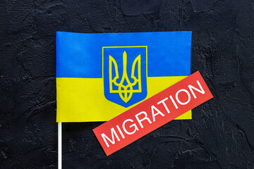 Word migration on Ukrainian flag. Ukrainian immigration concept
