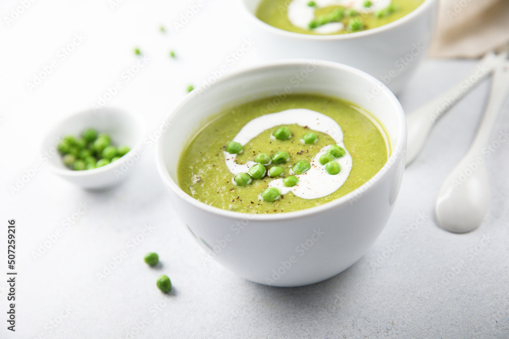 Wall mural Homemade green pea soup with cream