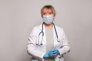 Female doctor standing ready to work. Healthcare and medicine concept
