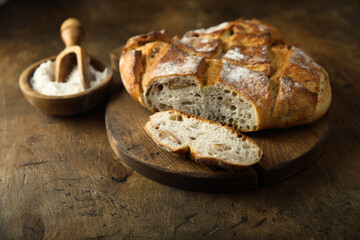 Fresh artisan bread on a wooden desk