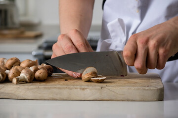 A Teenage Boy Cooking In A Kitchen