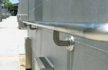 Steel railing structure installed on corridor wall.