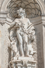 Old statue of a sensual Baroque Era man in downtown of Dresden, Germany, details, closeup.