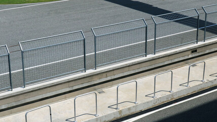 Steel wire mesh fence in racing track top view.   - obrazy, fototapety, plakaty