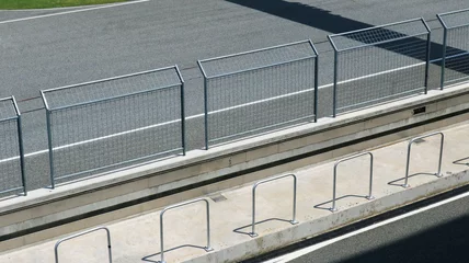 Foto op Plexiglas Steel wire mesh fence in racing track top view.   © Benjamin Salazar 