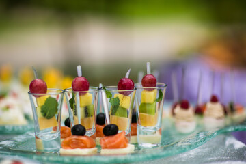 buffet treats fruits canapes on the table