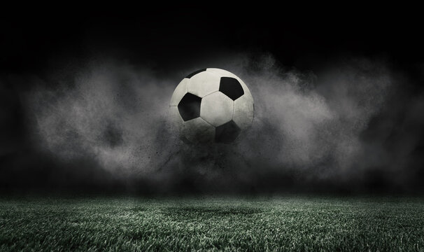 Soccer ball jumping on green grass of football field isolated on dark background with smoke. Concept of sport, art, energy, power. Creative collage. World cup concept