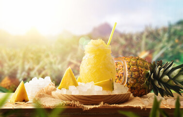 Pineapple slush on a table in field with pineapple crops © Davizro Photography