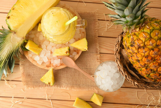 Freshly Made Pineapple Slush On A Wooden Table In Field