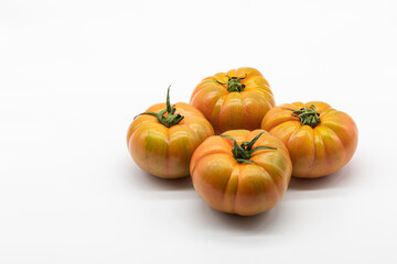 Fototapeta na wymiar Delicious ripe tomatoes for salad isolated on a white background