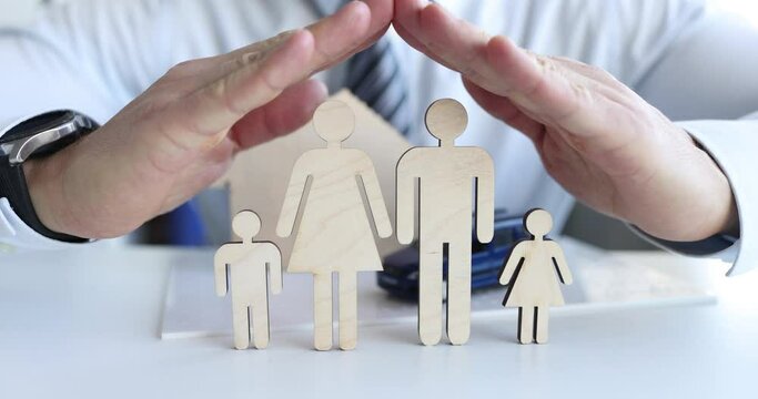 Family insurance hands protecting family and property