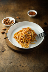 Pasta with red pesto and cheese