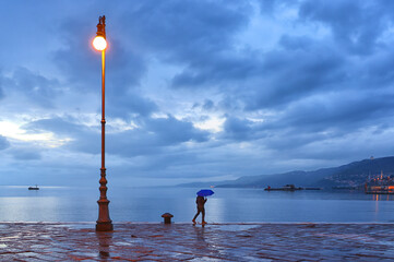 Rainy evening light over Trieste Pier in Italy, Europe