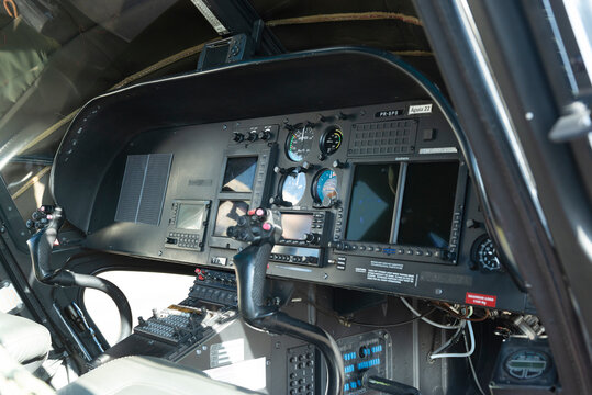 Cyclic control sticks and dashboard inside a helicopter