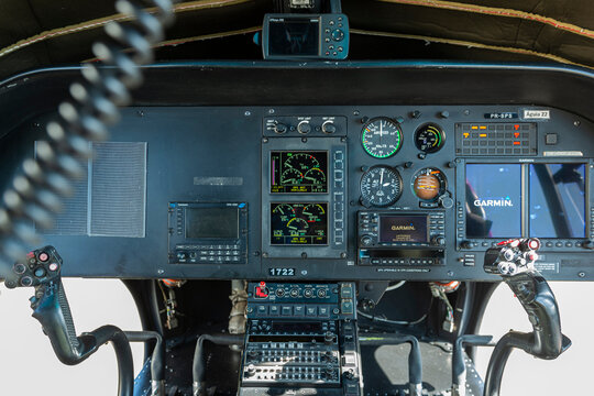 Cyclic control sticks and dashboard inside a helicopter