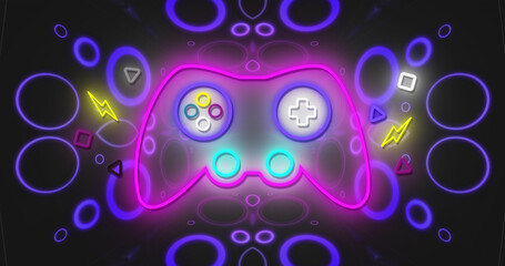 Image of neon gaming pad over neon circles and shapes on black background