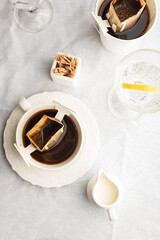 Drip coffee bag in a mug. Trends in brewing coffee at home.