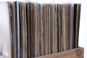 close-up of vinyl records, antiques, old furniture, tables, used things, clothes and other goods...